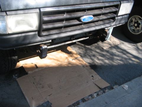 1991 Ford Bronco - Front view of a 1991 Ford Bronco, showing the grille and bumper area with a blue Ford emblem.