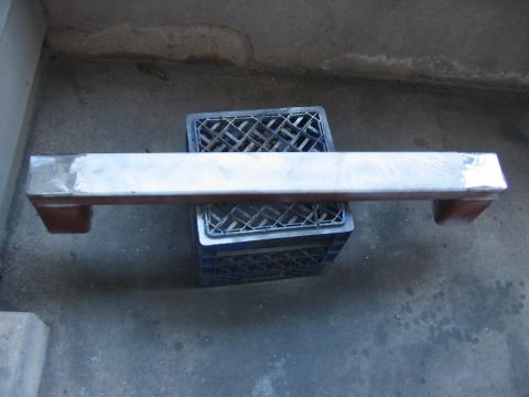 1991 Ford Bronco - A metal bar rests on milk crates, possibly a custom part or modification.