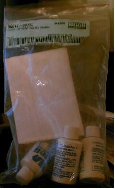 1986 Ford Bronco - Automotive touch-up paint kit for Molten Orange color, includes applicator.