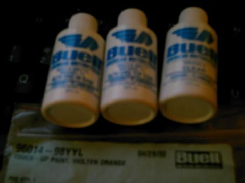 1986 Ford Bronco - Three bottles of Buell touch-up paint are shown, with a label indicating 'Molten Orange' color.