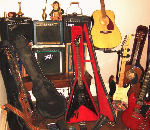 1978 Ford Bronco - A variety of guitars and amplifiers are displayed together in a room.