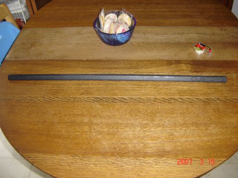1993 Ford Bronco - A trim piece labeled 'CUSTOM' is shown on a wooden table, next to a bowl of fortune cookies.