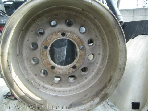 1968 Ford Mustang - Aluminum wheel with stamped text indicating maximum inflation pressure.