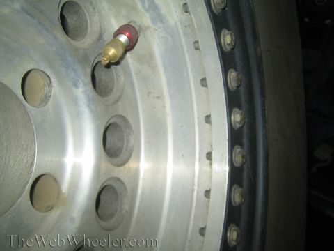 1968 Ford Mustang - A close-up view shows the details of a large truck wheel, including the tire and valve stem.