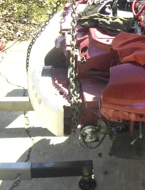1997 Ford Taurus - The engine is suspended by chains, ready for removal or installation.