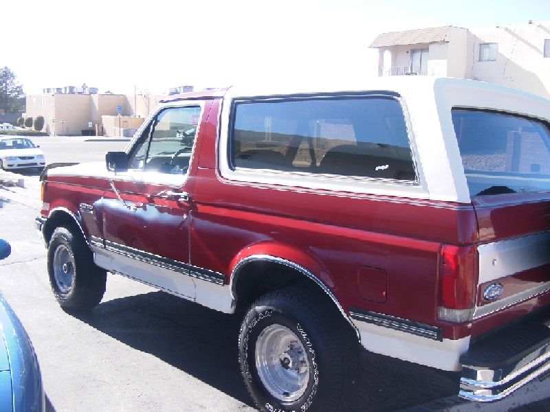 1989 Ford Bronco, red and white, side view