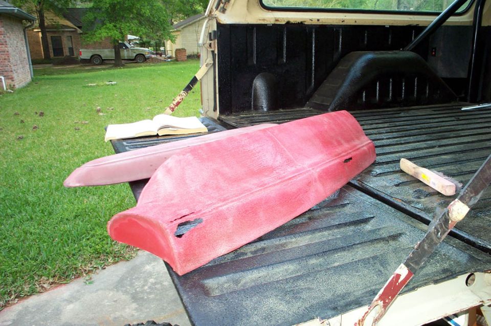 Red door panels in a truck bed with an open book