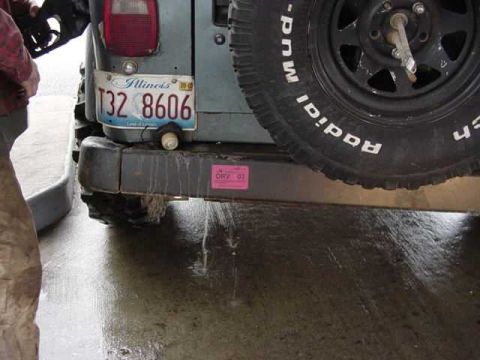 1992 Ford Bronco - A vehicle's rear bumper and spare tire are visible, with an Illinois license plate.