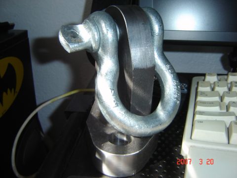 1993 Ford Bronco - A close-up view of a metal tow hitch shackle, with a keyboard and computer monitor visible in the background.