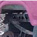 1992 Ford Bronco - Close-up view of an engine block, partially obscured by pink fabric.