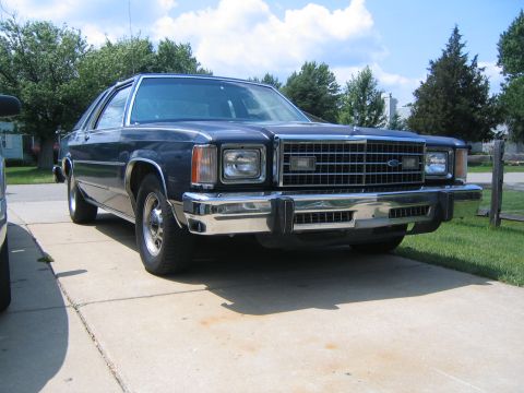 1999 Mercury Grand Marquis - This sedan's front grille and headlight design are characteristic of the late 1970s, not a 1999 model.