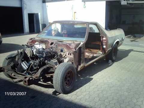 1979 Ford Ranchero - This 1979 Ford Ranchero is in a state of disrepair, with its engine compartment exposed and interior stripped.