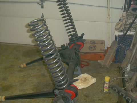 1986 Ford Bronco - Suspension components, including coil springs, are shown disassembled.