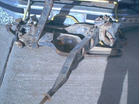 1986 Ford Bronco - Front axle assembly with suspension components, likely for an off-road vehicle.
