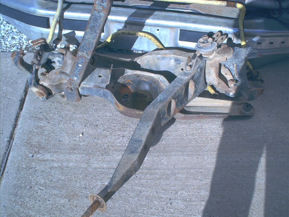 Front axle assembly with suspension components
