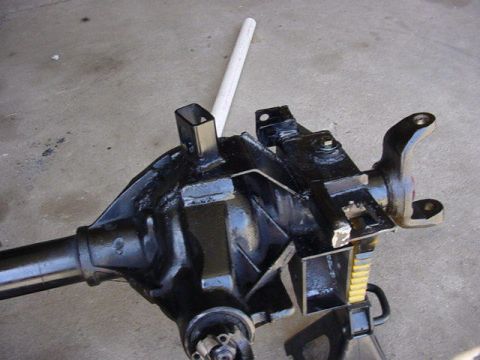 1992 Ford Bronco - Rear axle assembly for a 1992 Ford Bronco sits on a concrete surface.