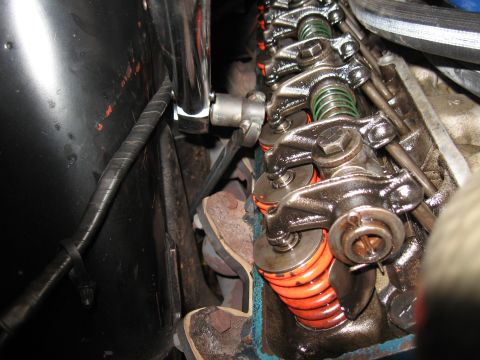 1968 Shelby GT500 - A close-up view of the internal components of an engine's valve train, showing rocker arms and springs.