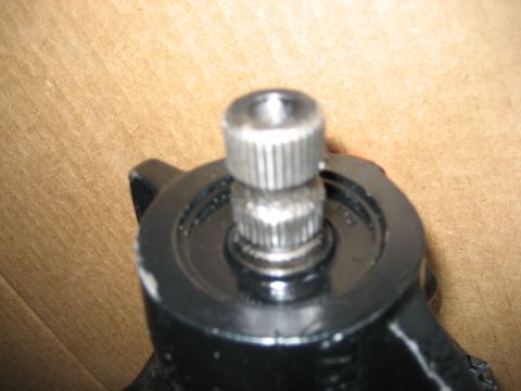 1979 Ford Bronco - A close-up view of a metal component with a splined shaft, possibly from a vehicle's steering mechanism.