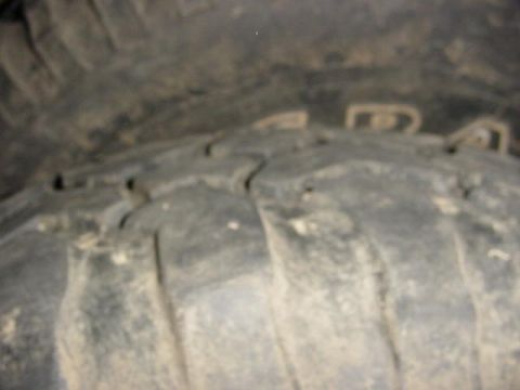 1992 Ford Bronco - Close-up view of a tire tread, showing wear patterns.