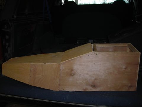 1994 Ford Bronco - Custom wooden console box installed in the cargo area of a vehicle.