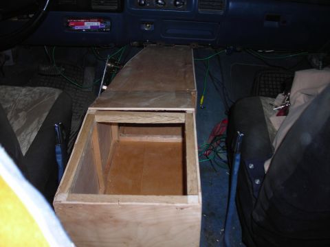 1994 Ford Bronco - Custom wooden center console installed in a 1994 Ford Bronco, showing wiring and unfinished construction.