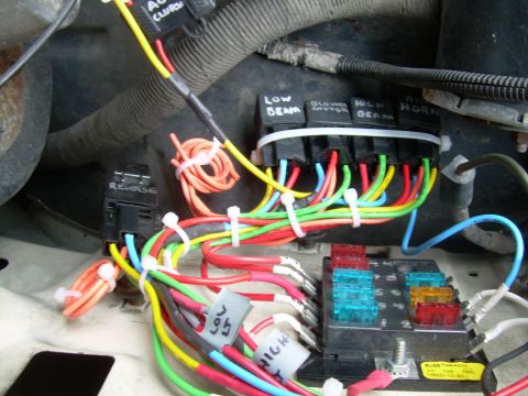 1988 Ford Bronco - Vehicle electrical system with multiple relays and a fuse box, showing organized wiring.