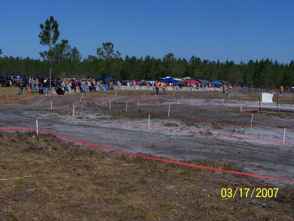 Off-road race track with spectators and vehicles, dated 03/17/2007