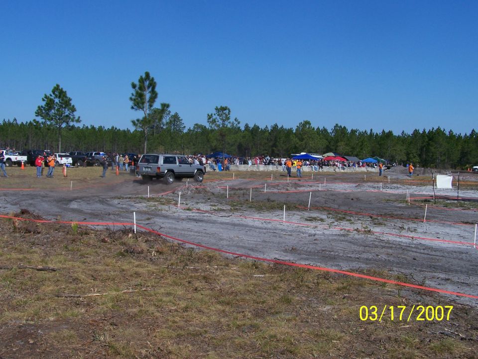 Off-road event with multiple vehicles and spectators, date stamp 03/17/2007