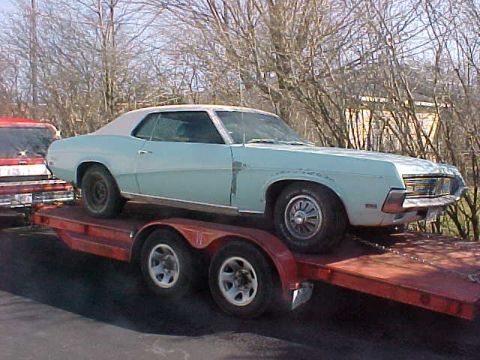 1969 Ford Torino - Light blue 1969 Ford Torino coupe being transported on a trailer.