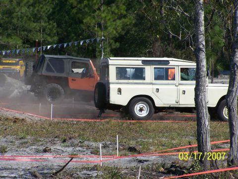 1989 Ford Bronco - Two off-road vehicles, a cream Land Rover Series III and an orange Jeep Wrangler, participate in an event on March 17, 2007.