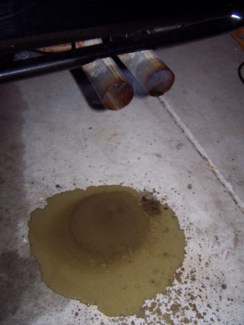 1994 Ford Probe - Fluid leak from exhaust pipes onto concrete floor.