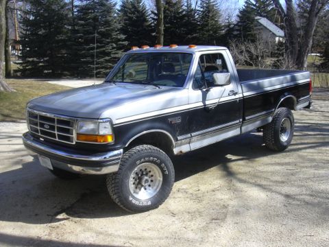 1992 Ford F-250 - This 1992 Ford F-250 pickup truck is shown from the front three-quarter angle.