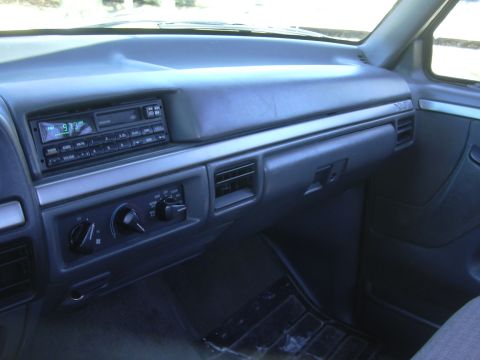1992 Ford F-250 - Interior view of a 1992 Ford F-250 dashboard, highlighting the radio and HVAC controls.