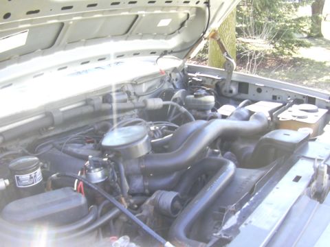 1992 Ford F-250 - Engine bay of a 1992 Ford F-250, showing the V8 engine and associated components.
