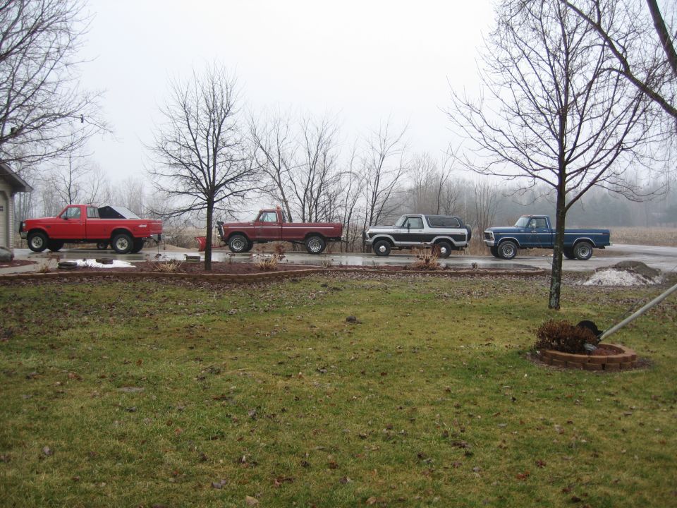 1978 Ford Bronco XLT parked in a line with other trucks