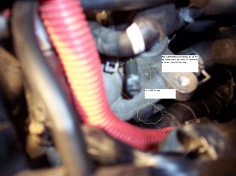 1995 Ford Probe - Close-up view of engine components with handwritten annotations questioning their origin and purpose.