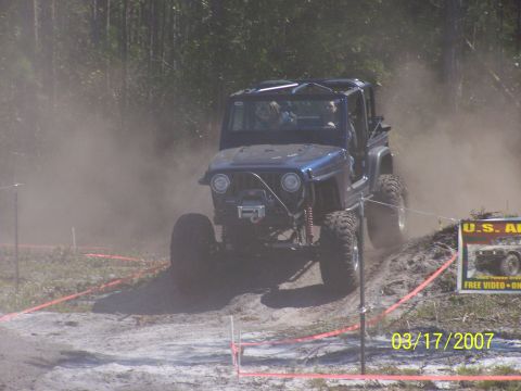 1989 Ford Bronco - A blue off-road jeep navigates a dusty course during an event on March 17, 2007.