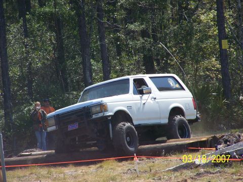1989 Ford Bronco - This 1989 Ford Bronco navigates a challenging obstacle during an off-road event.