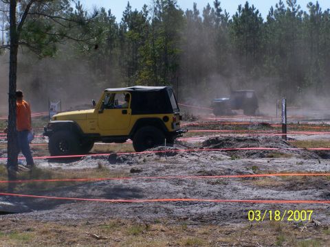 1989 Ford Bronco - Two Jeeps navigate a dusty off-road course on March 18, 2007.