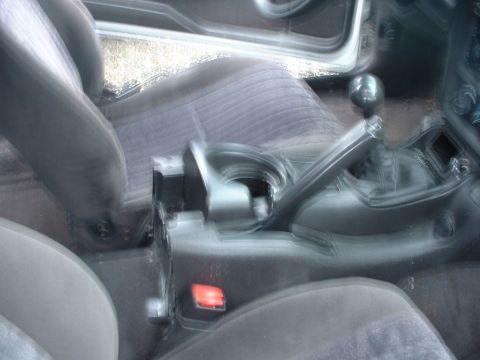 2000 Ford Crown Victoria - Interior view of a car's center console with gear shifter and seats visible.
