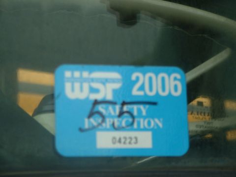 2000 Ford Crown Victoria - A blue safety inspection sticker shows the year 2006 and inspection number 04223.