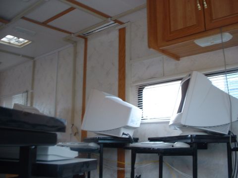 2000 Ford Crown Victoria - Interior view of a room with computer equipment and cabinetry.