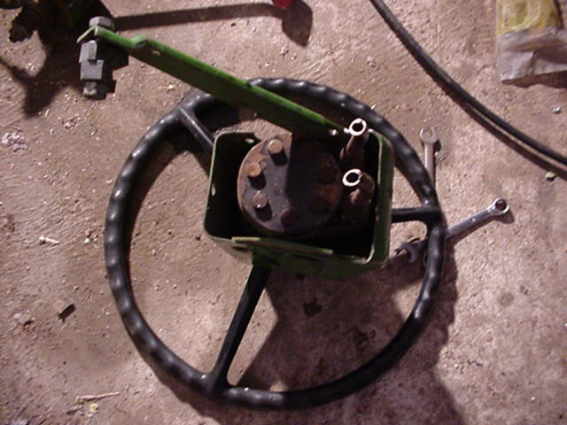 Steering wheel, column, and linkage assembly on the floor