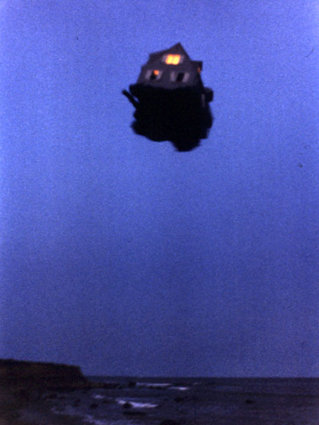 1979 Ford Bronco - A strange object resembling a house floats in the sky above the sea.