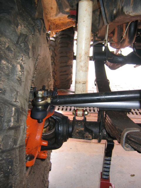 1979 Ford Bronco - Close-up view of the front axle and suspension components of an off-road vehicle.