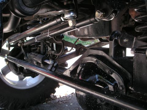 1999 Jeep Grand Cherokee - Undercarriage view of a vehicle's steering and suspension system, heavy-duty components.