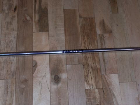 1995 Ford Probe - Chrome strut bar with 'RACING' logo visible, placed on a wooden floor.