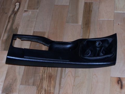1995 Ford Probe - A black car door panel is shown from an interior perspective, lying on a wooden floor.