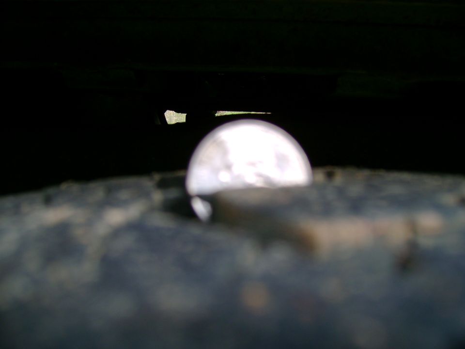 Close-up of a wheel well with a bright reflection