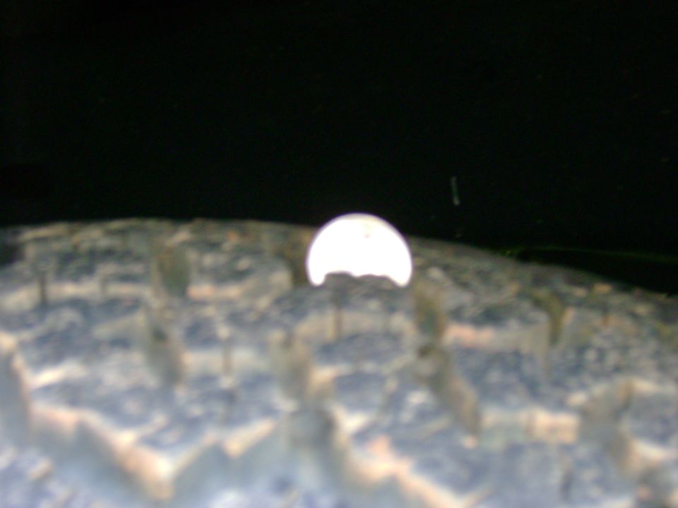 Close-up of tire tread with a bright reflection